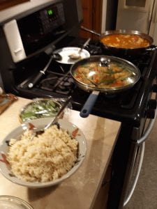 Multiple pans and bowls used for Thai dish